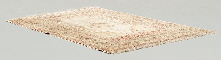 A RUG, an antique silk Tabriz, ca 165 x 118,5-111,5 cm.