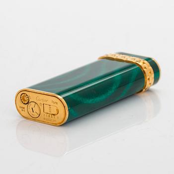 Cartier, A gilded and laquered metal lighter. Marked Cartier, Paris, 6846 X, Swiss made.