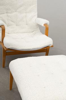 BRUNO MATHSSON, an "ingrid" armchair and stool for Dux. Late 20th century.
