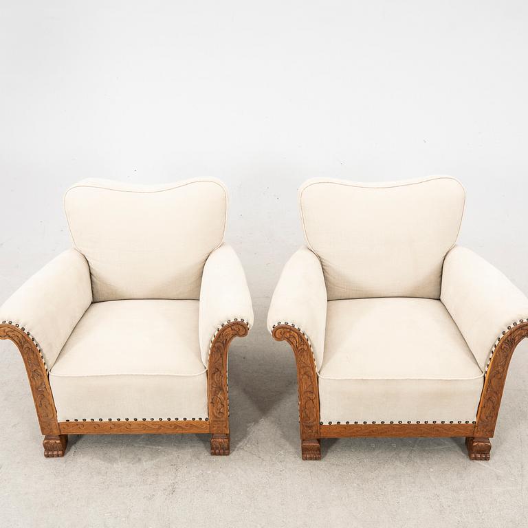 A pair of easy chairs from the first half of the 20th century.