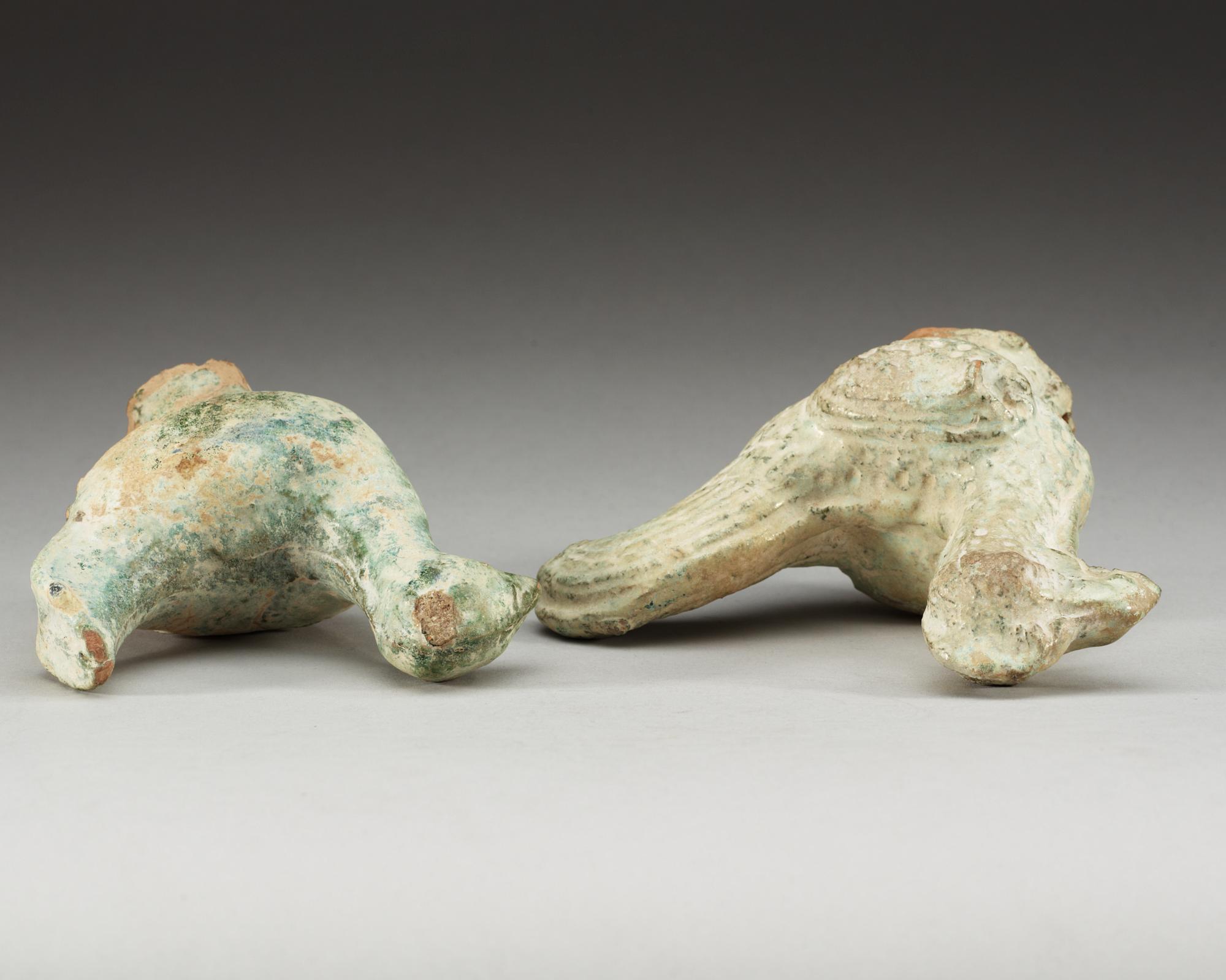A set of two green glazed pottery models of a rooster and a hen, Han dynasty (206 BC- 220 AD).