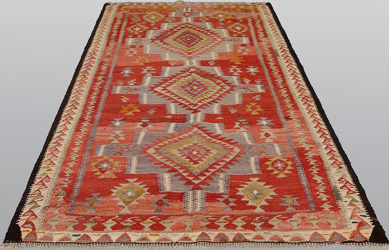 A Persian nomadic kilim, approximately 260 x 150 cm.
