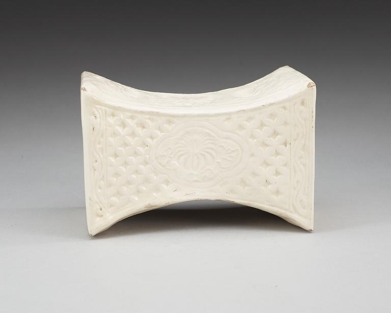 A cream glazed pillow, Song/Jind dynasty. With seal marks of a family and a date to the short sides.