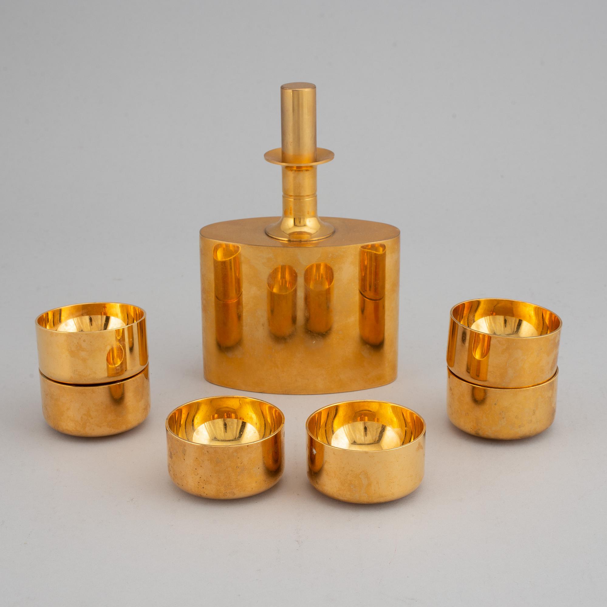 PIERRE FORSSELL, a gilt brass flask and six cups, Skultuna.
