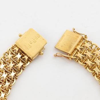 Armlänk, 18K guld med syntetisk färgväxlande safir.