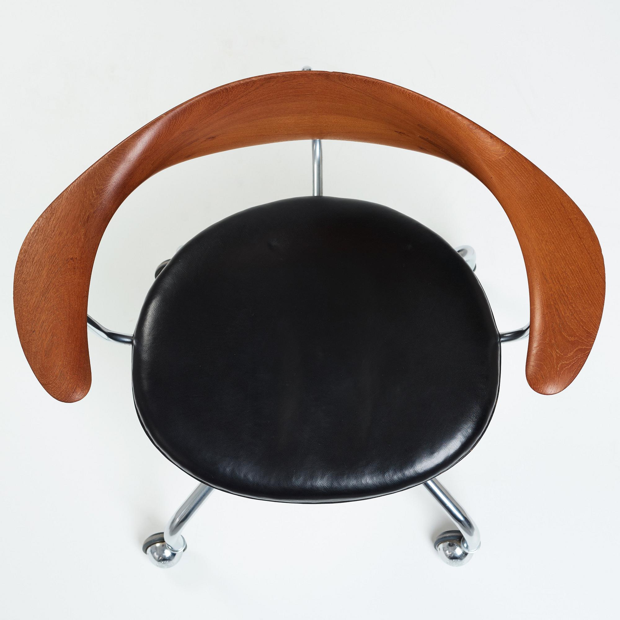 Hans J. Wegner, a "Swivel Chair" /JH502, executed by Johannes Hansen, Denmark 1960's.