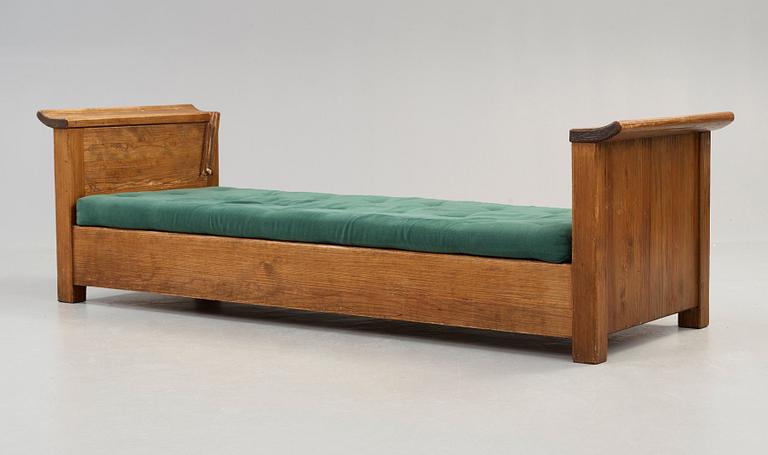 An Axel Einar Hjorth stained pine sofa 'Sandhamn', by Nordiska Kompaniet ca 1929.