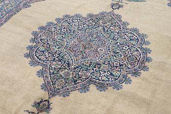 A semi-antique Kerman carpet, figural, c. 371 x 285 cm.