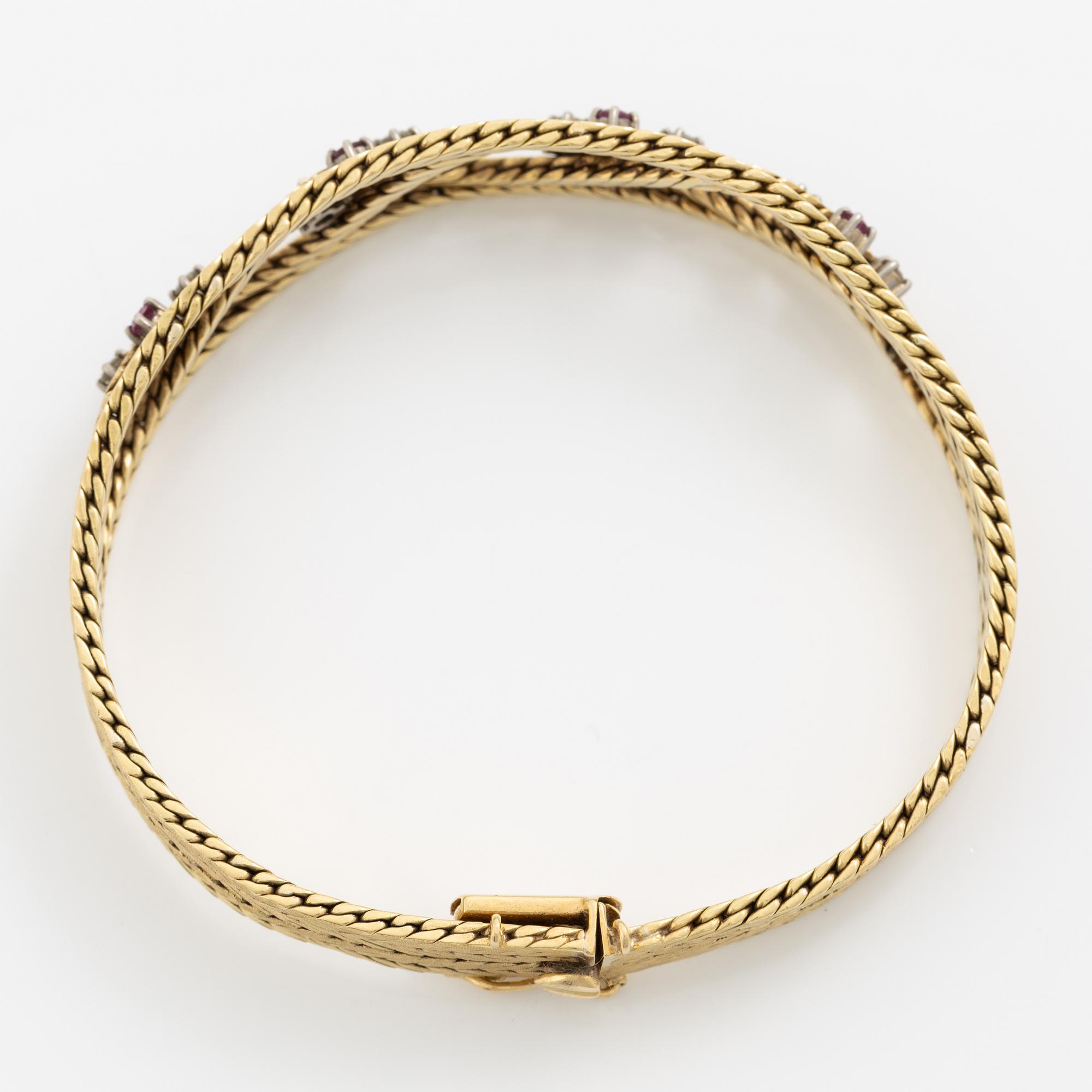 Bracelet 18K gold with diamonds and rubies.