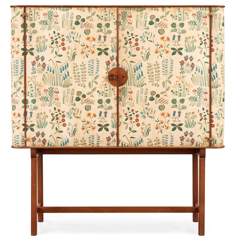 A Josef Frank mahogany cabinet, doors and sides covered in Frank's floral chintz fabric 'Fatima', Svenskt Tenn ca 1937.