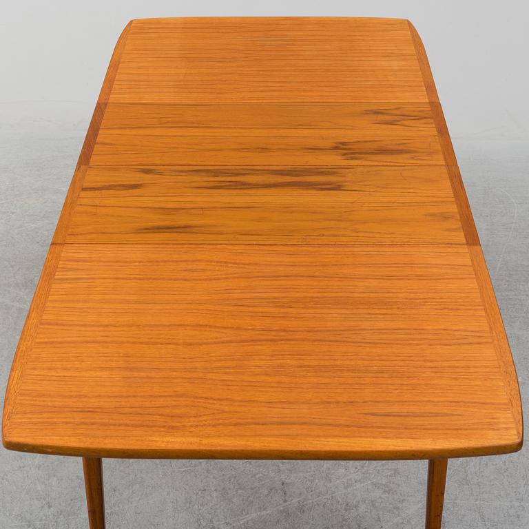 A second half of the 20th century teak veneered dining table.