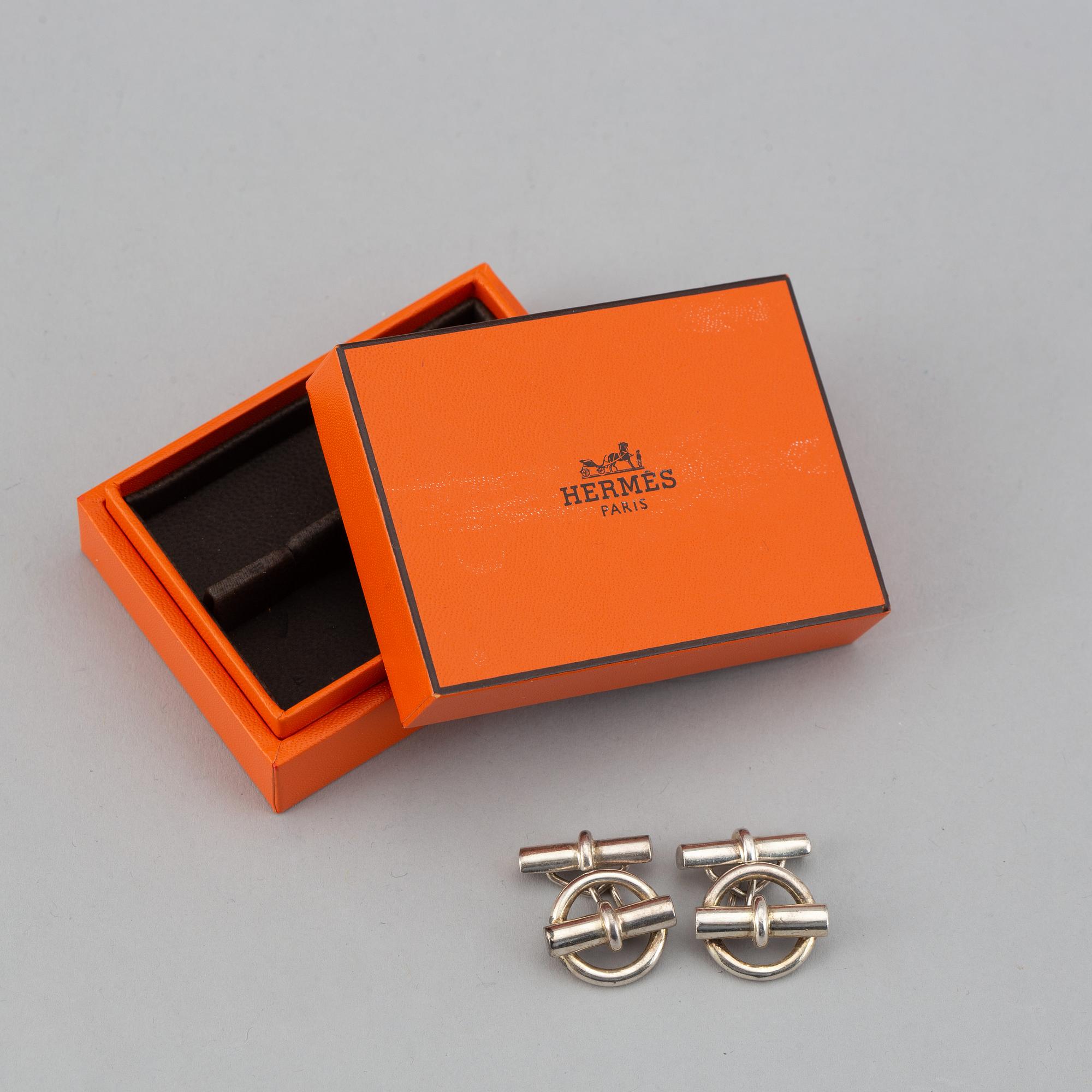 HERMÈS, a pair of silver cuff links.