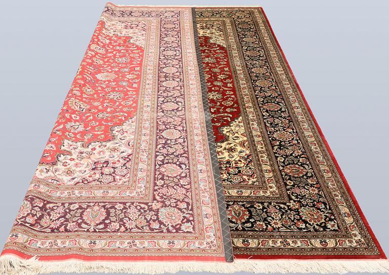A silk Ghom carpet, c. 346 x 247 cm.