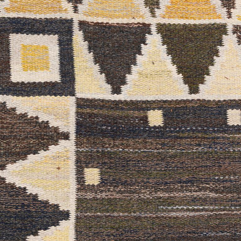 A flat weave rug, c. 245 x 185 cm.