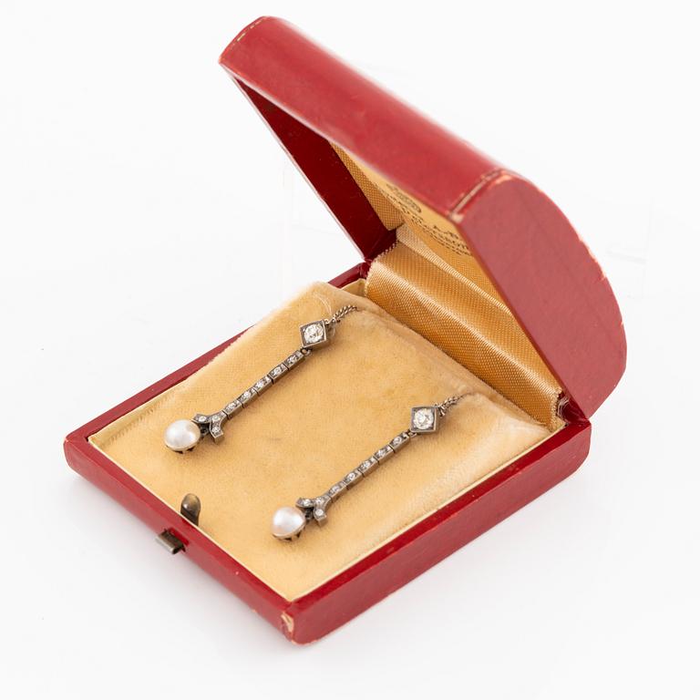 A pair of 18K gold and cultured pearl earrings.