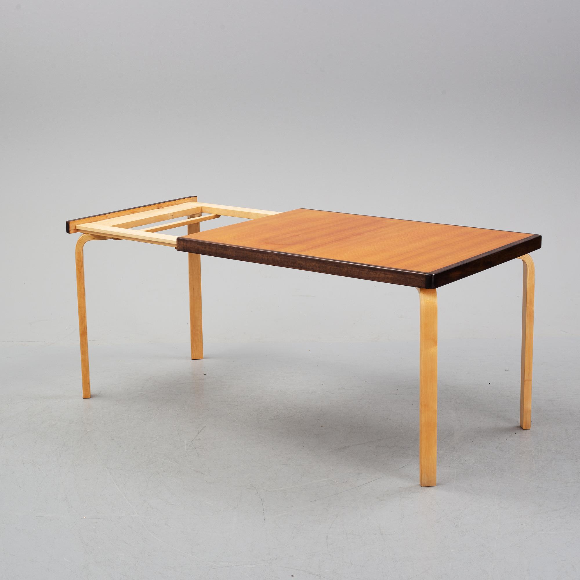 Alvar Aalto, a teak dining table, Artek, Finland, mid 20th Century.