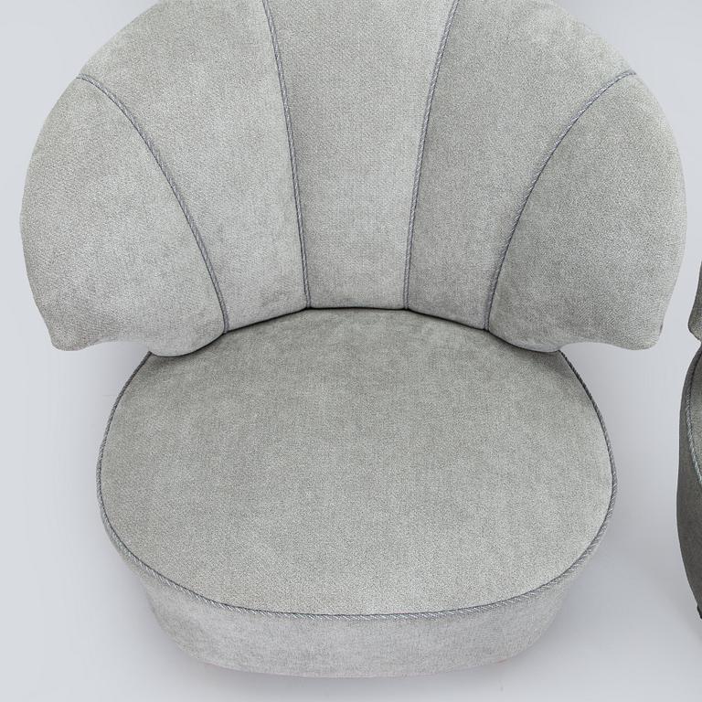 A pair of mid 20th century armchairs.