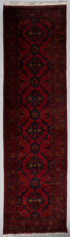 An Afghan runner, ca. 295 x 82 cm.