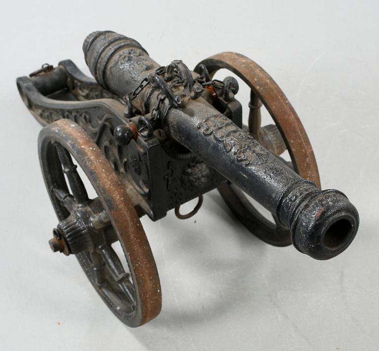 A small cast iron cannon, 19th or early 20th century.