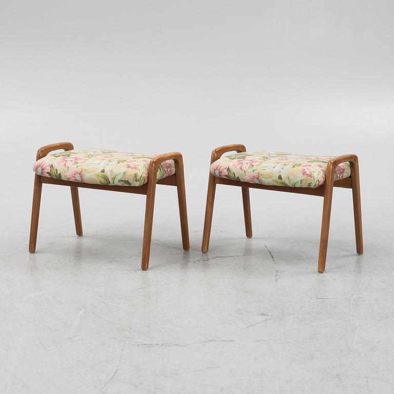 A pair of ottomans, 20th century.