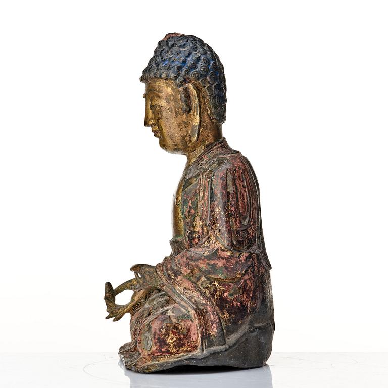 A seated bronze figure of buddha, Ming dynasty (1368-1644).