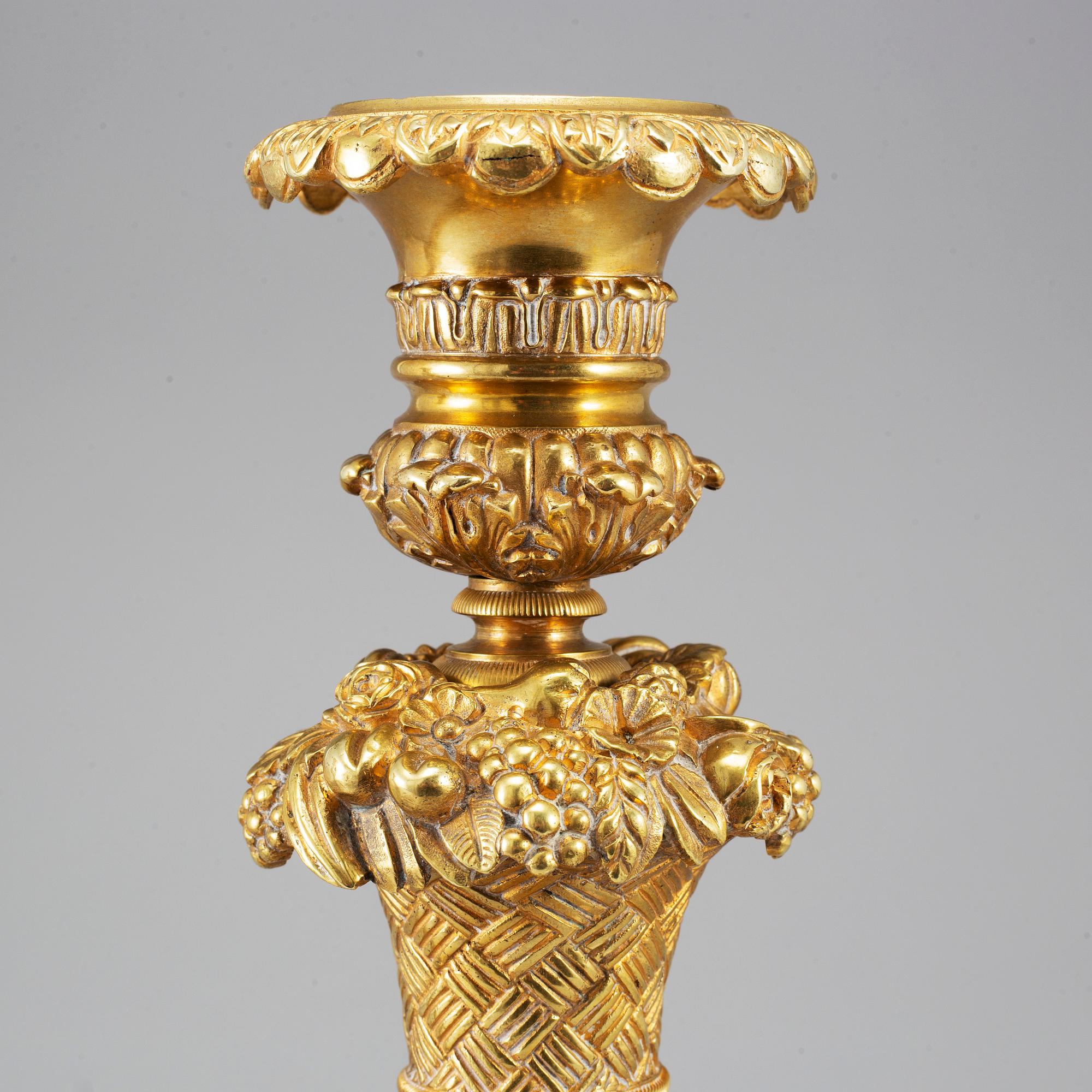 A pair of French Empire candlesticks, first half of the 19th century.