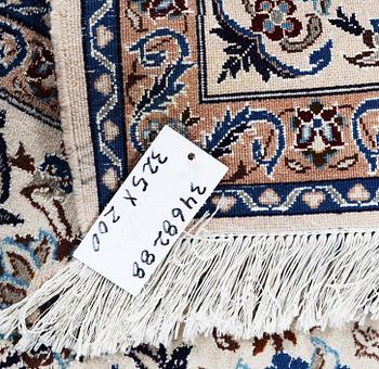 A carpet, Nain, part silk, 6 laa, c. 325 x 200 cm.