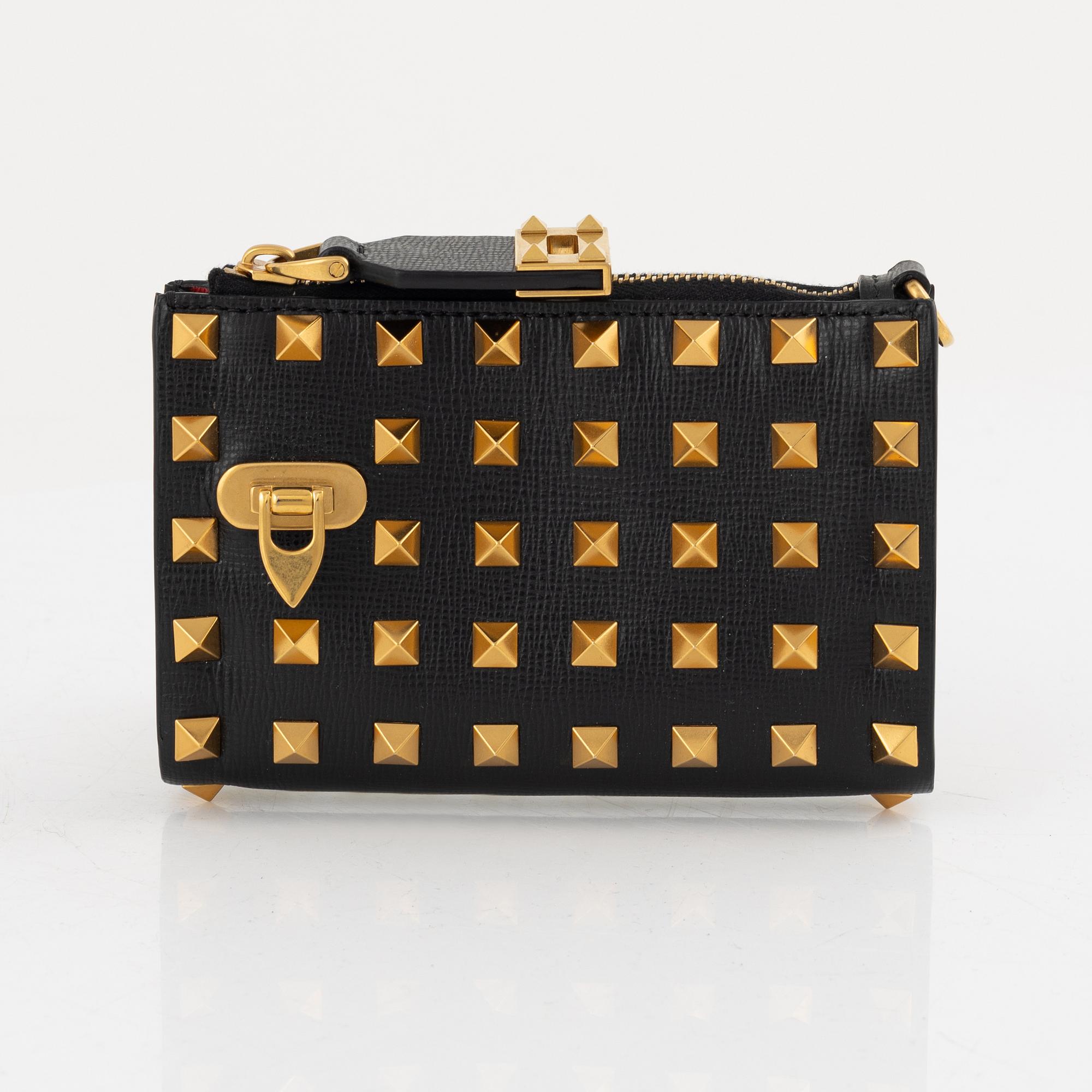 Valentino Garavani, a leather and studs wallet.