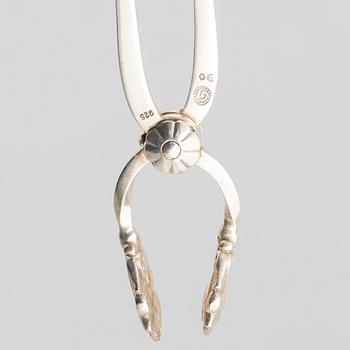 Sugar box, silver 830, Swedish import mark, and sugar tongs, sterling silver, Georg Jensen, Denmark.