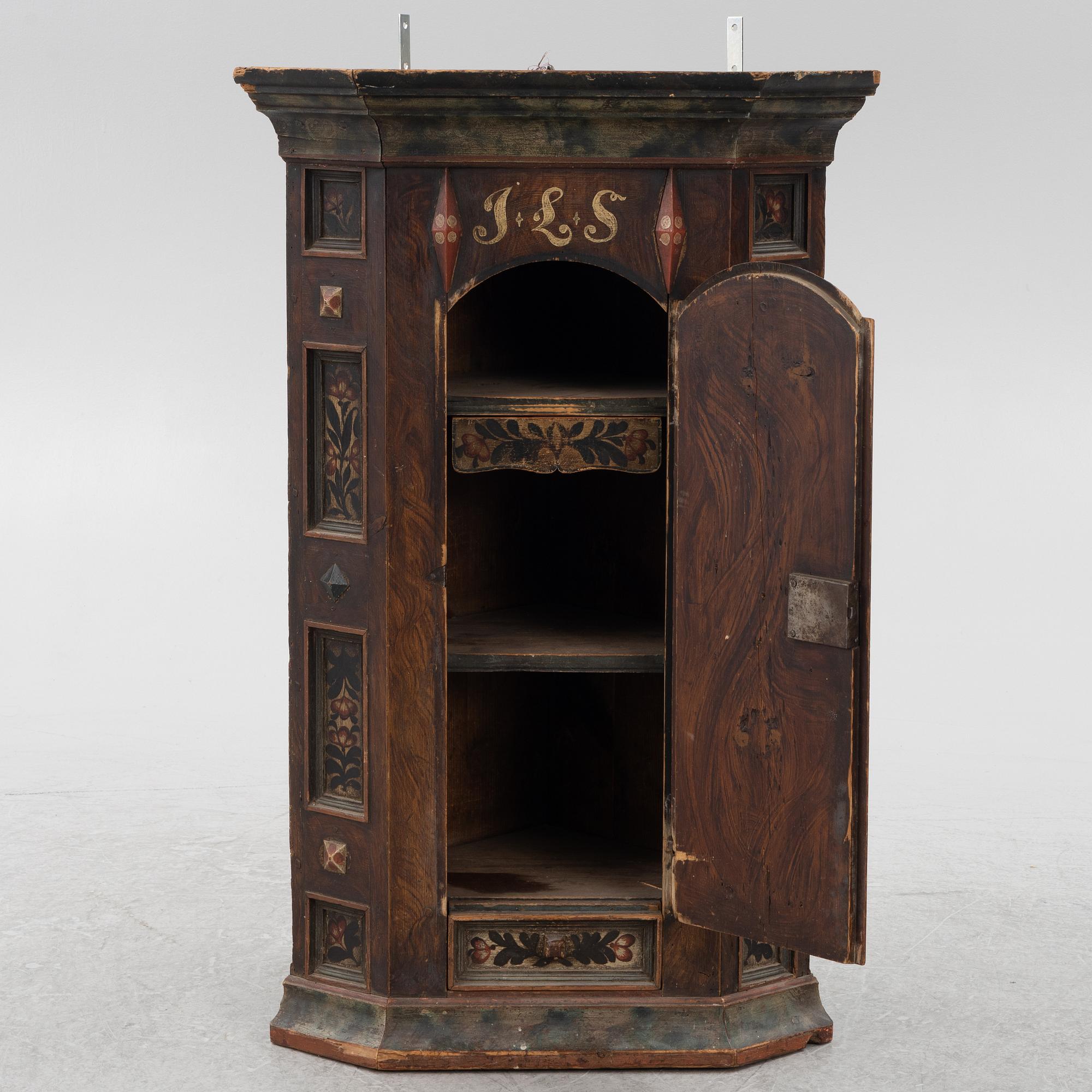A Swedish painted corner cupboard, 18th Century.
