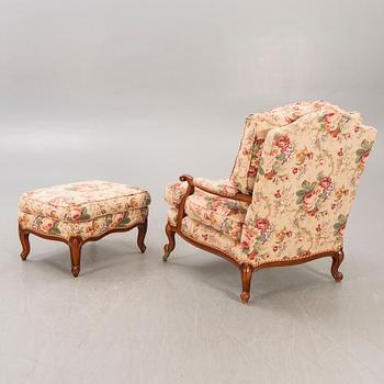 A Louis XV-style armchair and footstool later part of the 20th century.