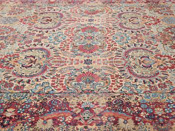 A carpet, a semi-antique Kerman, ca 375-379,5 x 268-271 cm.