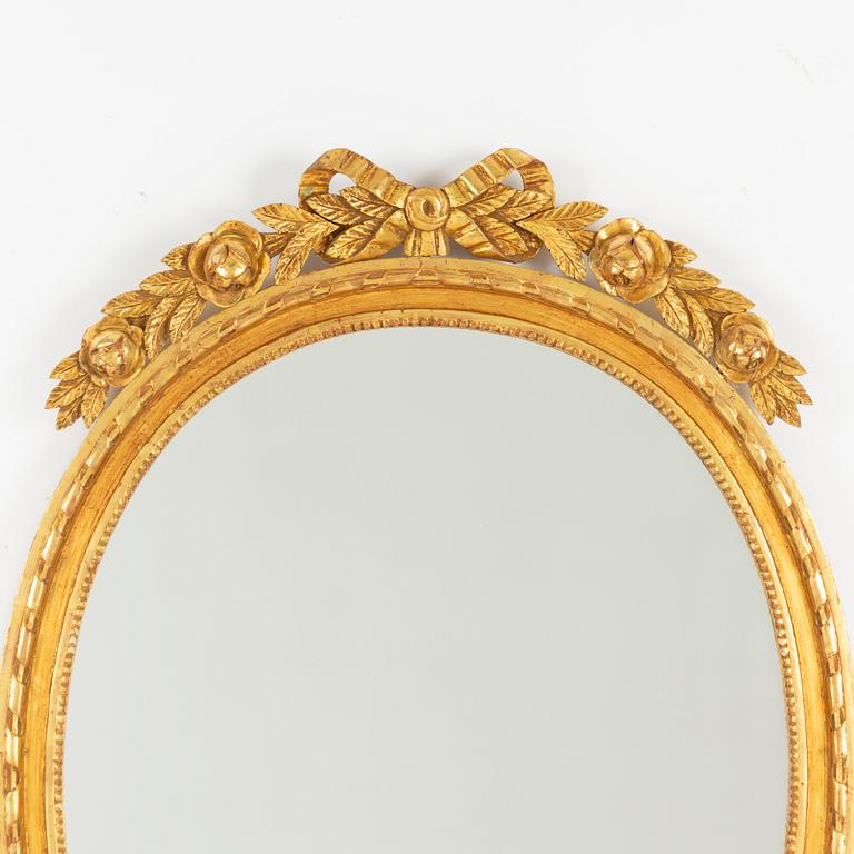 A Gustavian style mirror, mid 20th Century.