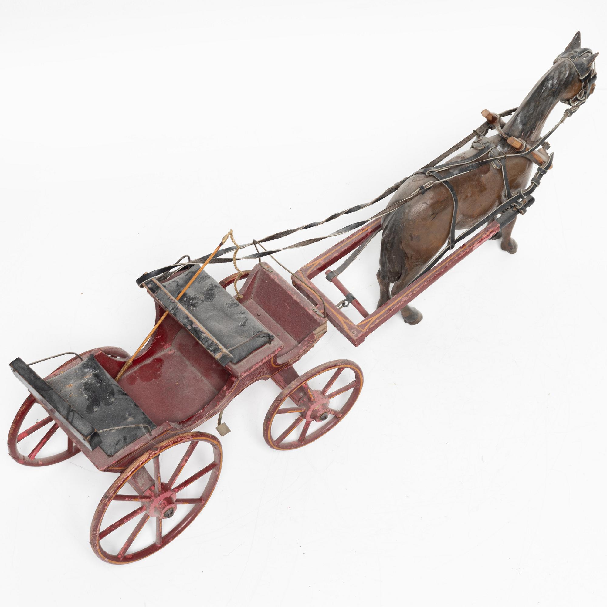 Horse-drawn carriage, early 20th century.