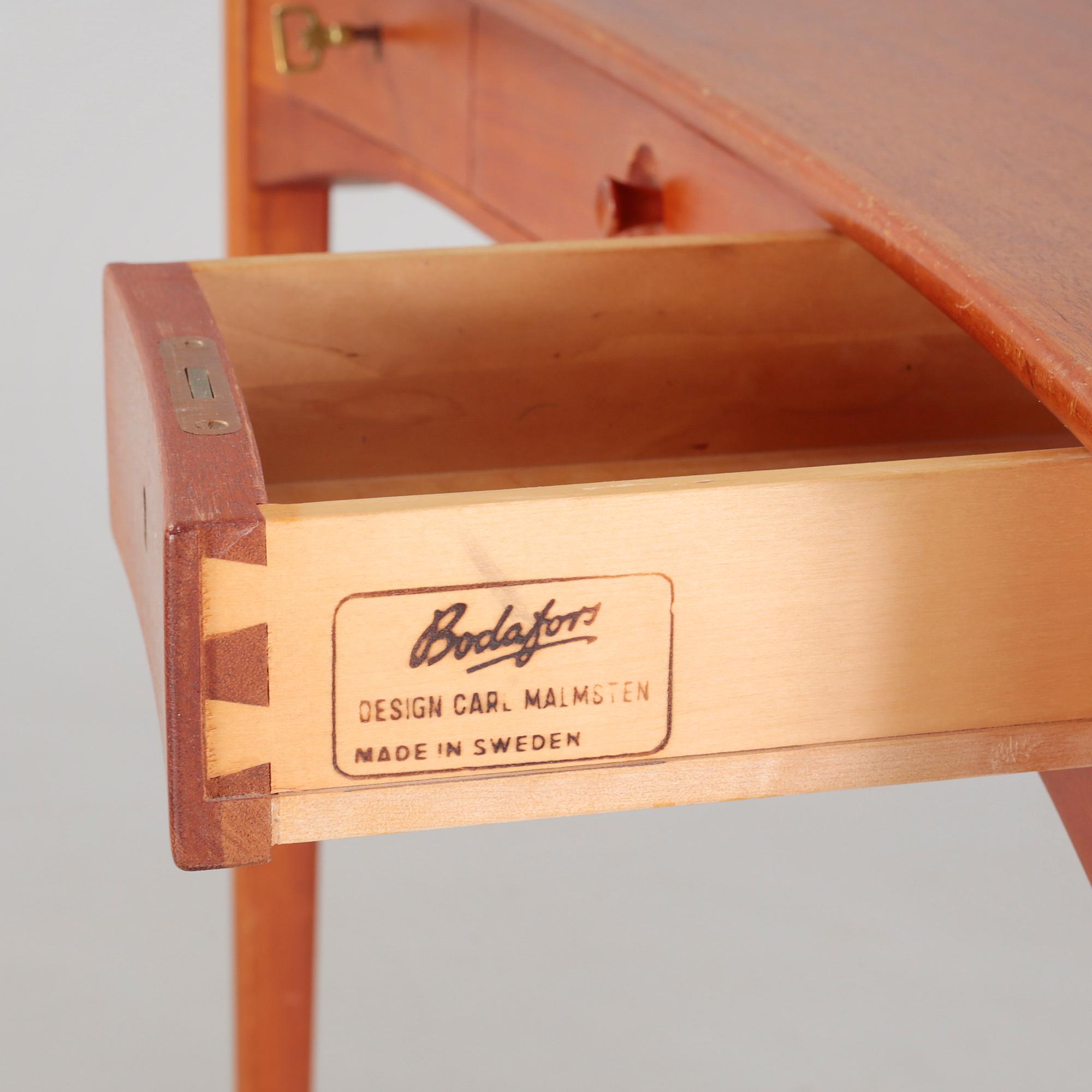 a table with mirror "Birgitta" veneered with teak designed by Carl Malmsten for Bodafors Möbelfabrik,