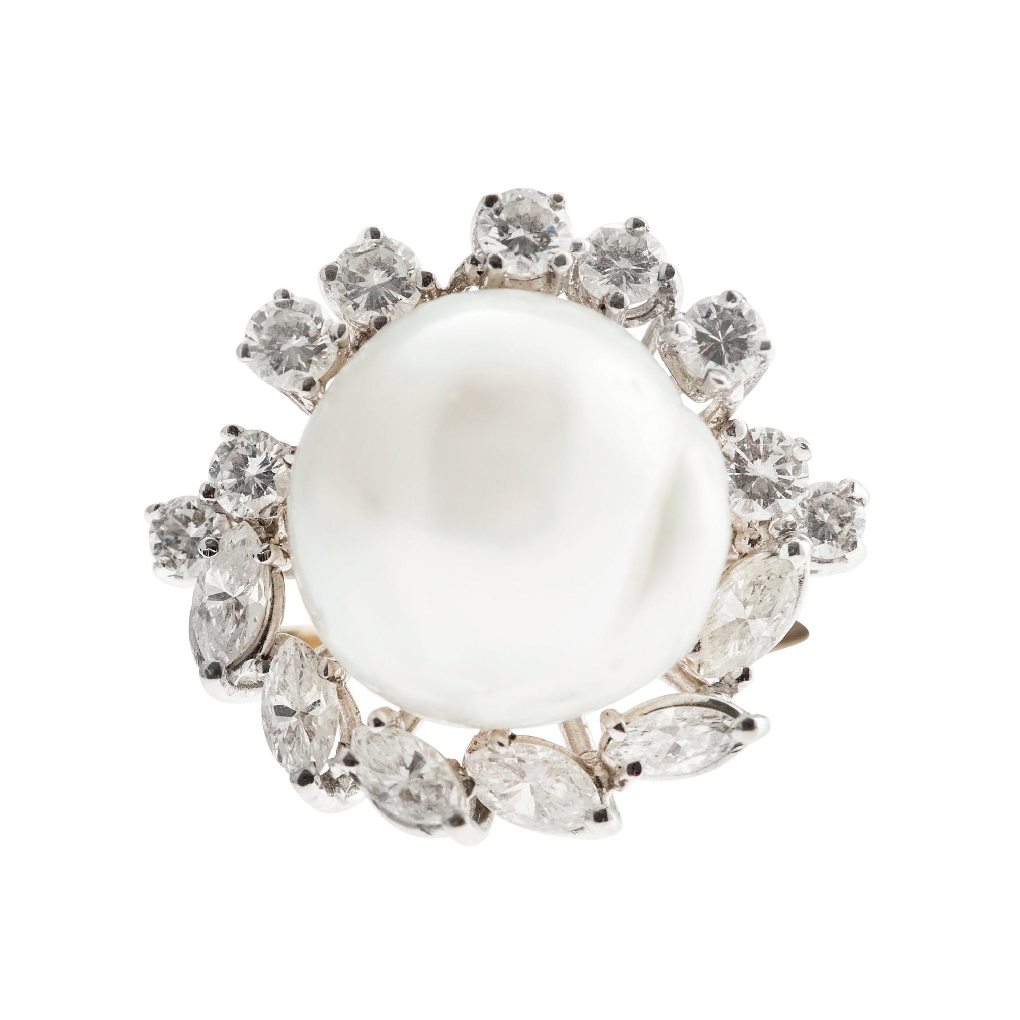 A RING, 18K white gold. Brilliant- and navette cut diamonds c. 1.05 ct H/vs. Baroque south sea pearl 12 mm.
