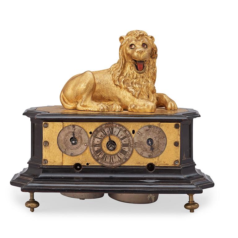 A rare gilt brass on ebonised base Lion Automaton figure clock, Augsburg circa 1630.