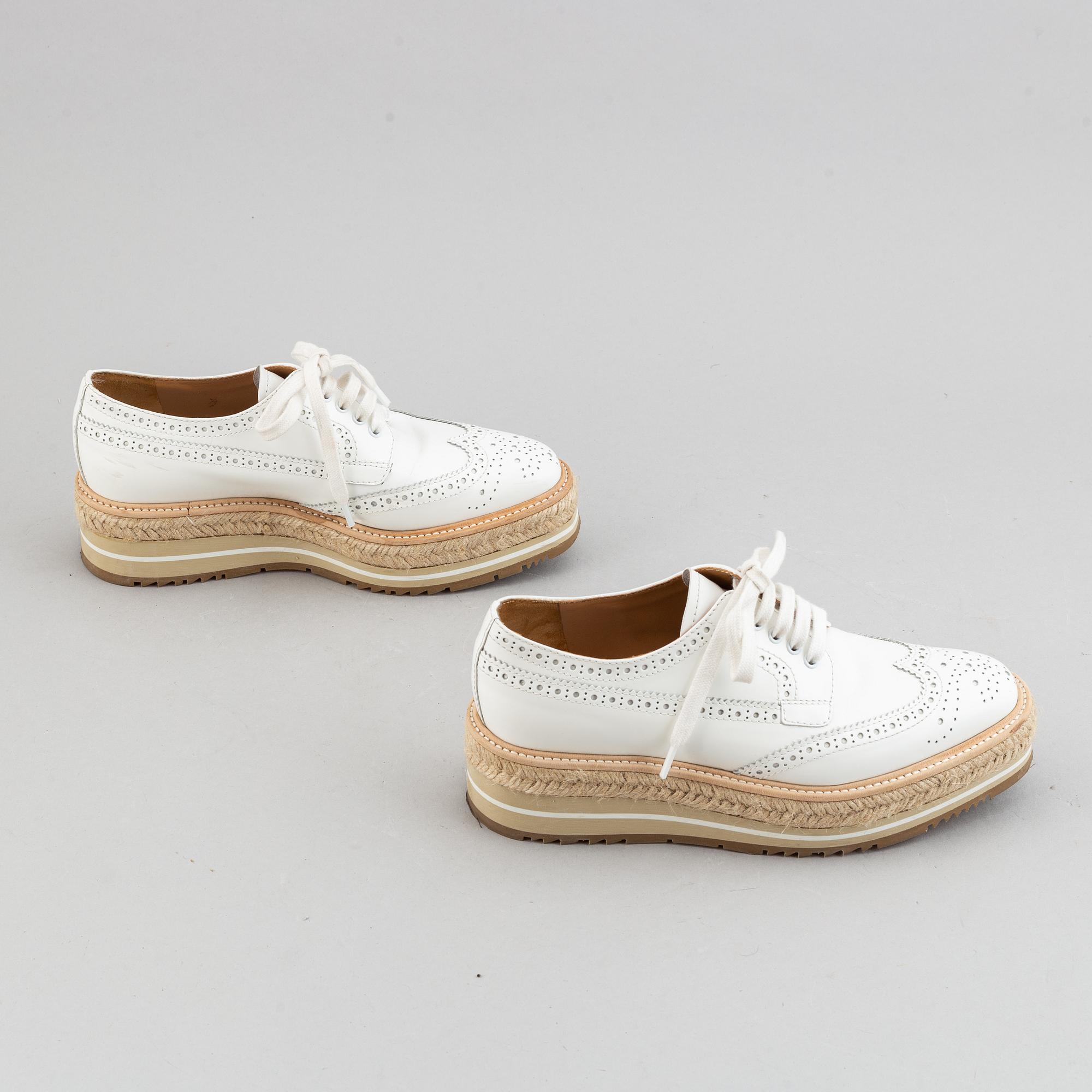 Prada, a pair of white leather brogues, size 36.