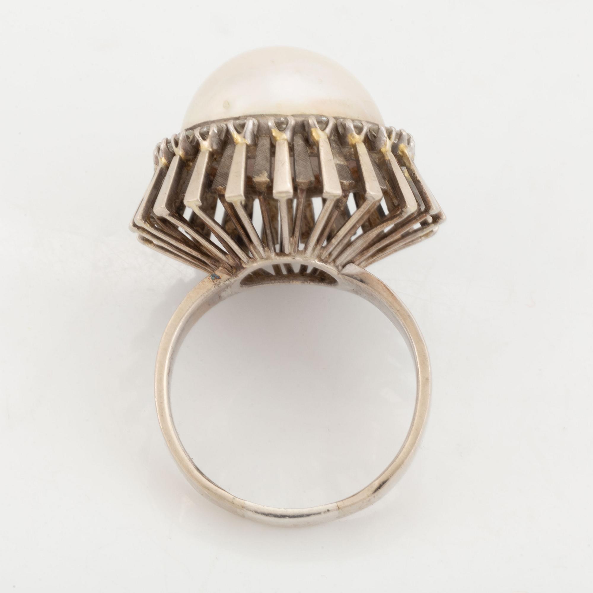 A pearl and diamond ring.