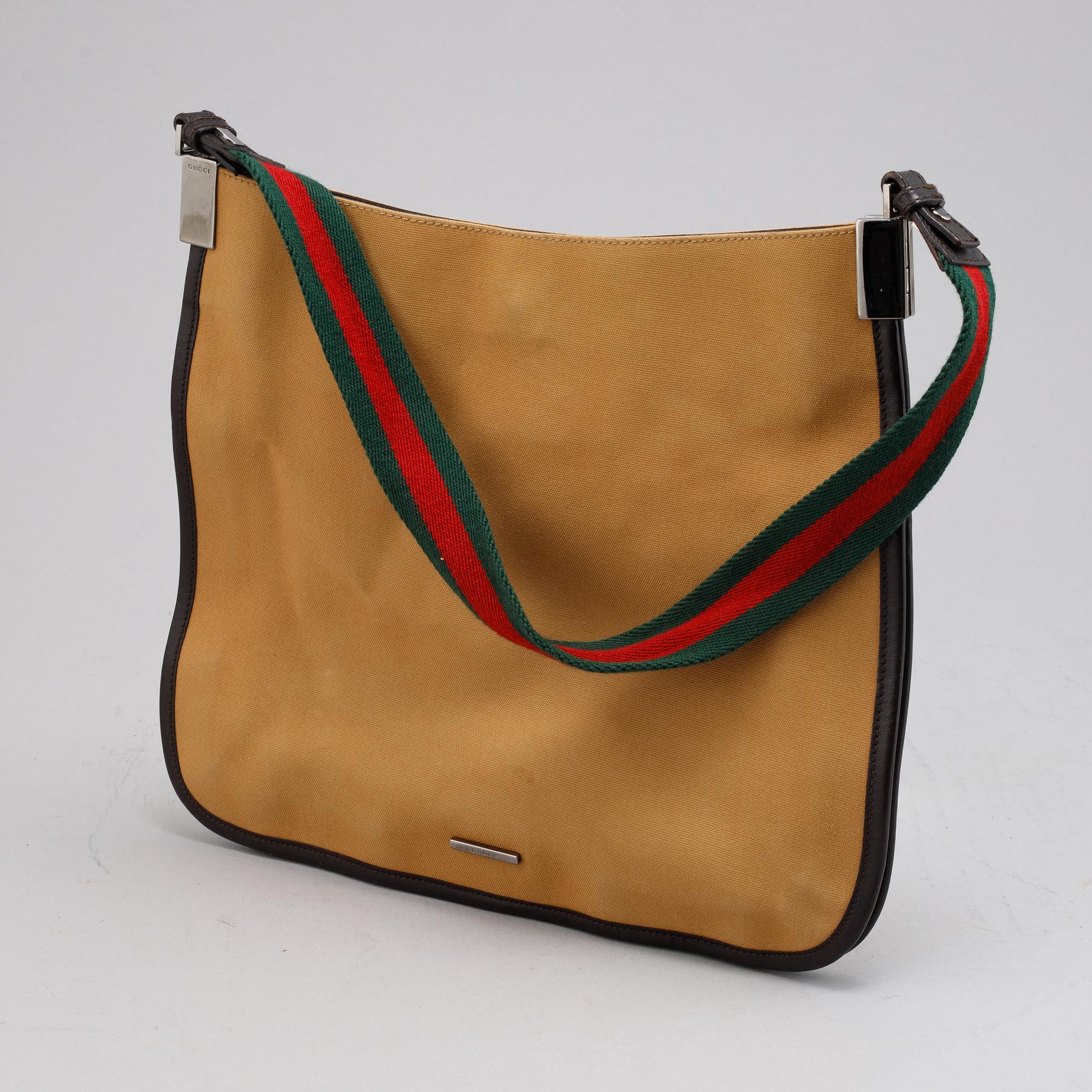 Gucci, a canvas handbag.