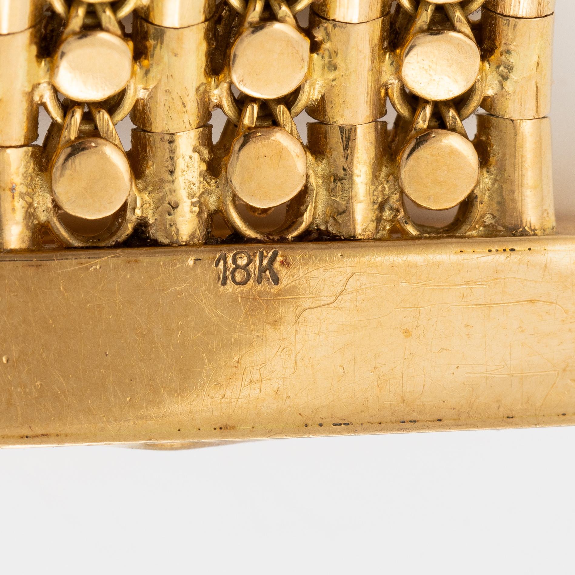 Armband 18K guld med tofs, 1900-talets andra hälft.