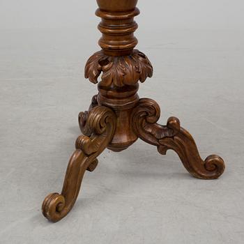 A mid 19th century sewing table.