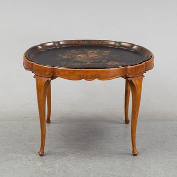 A rococo style side table with a loose tray.