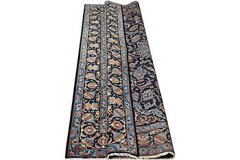 A Kashmar rug, part silk, c. 234 x 142 cm.