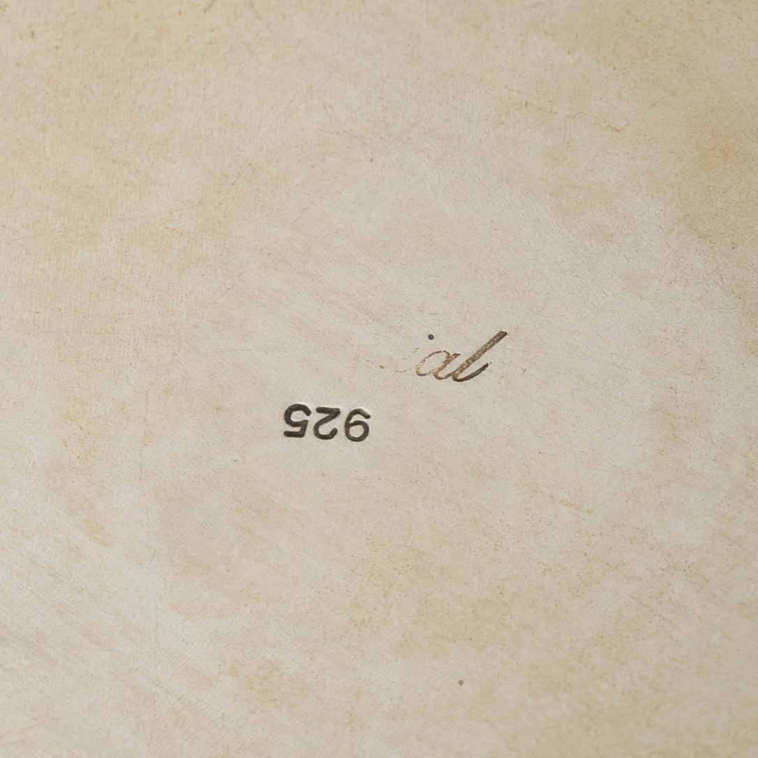 Coaster, sterling silver, 20th century.