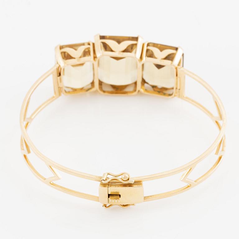 Bracelet 18K gold with faceted quartz.