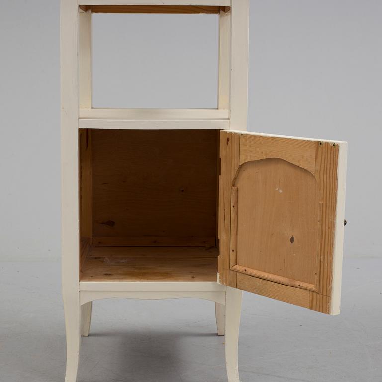 A early bedside table with marble top.