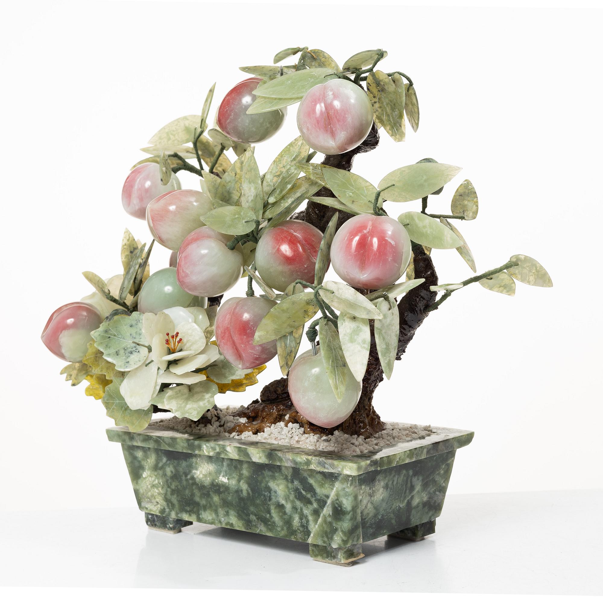 A stone table decoration in the shape of a peach tree, China, 20th century.