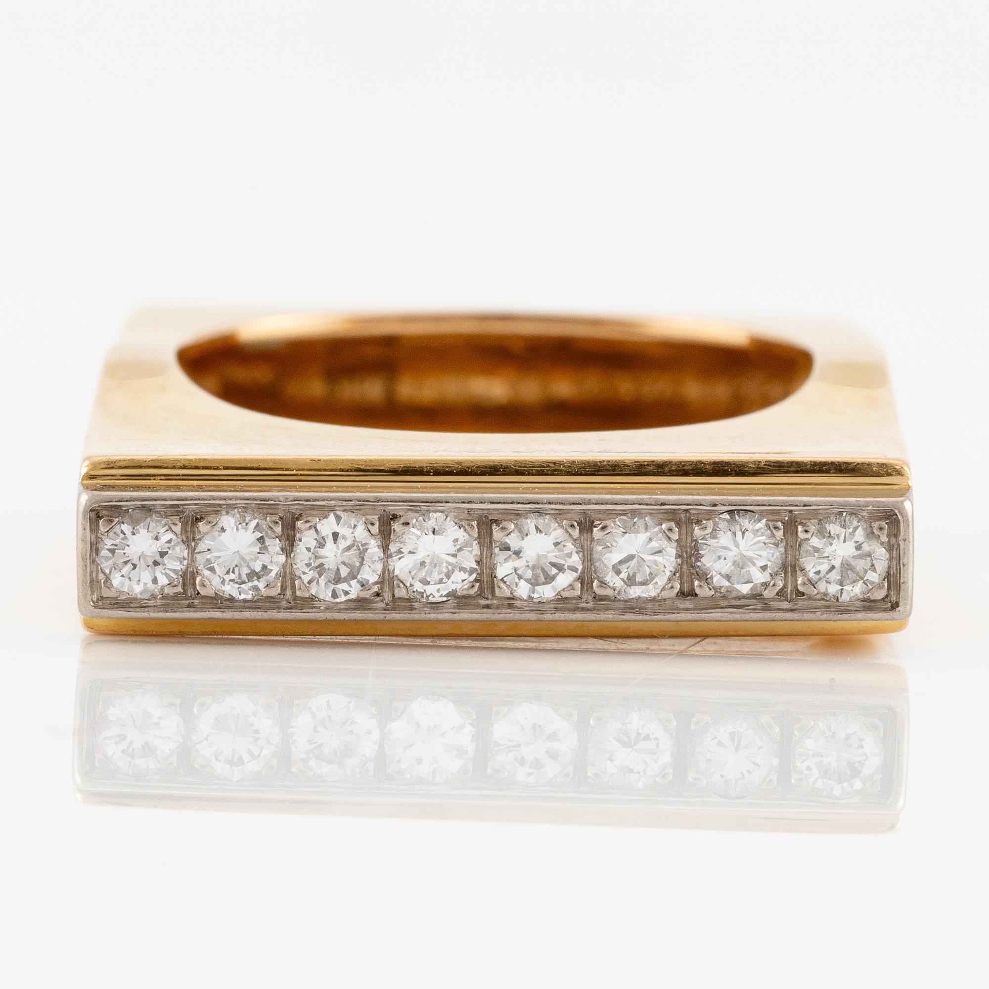 A W.A. Bolin ring in 18K gold set with round brilliant-cut diamonds.