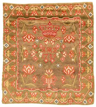 324. A Finish knotted pile bed cover ca 181,5 x 160 cm, dated 1789.